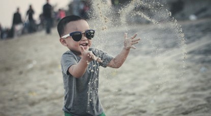 Kid playing in the sand
