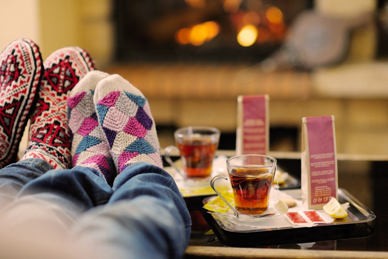 Comfy socks, snuggling in front of a fire with tea