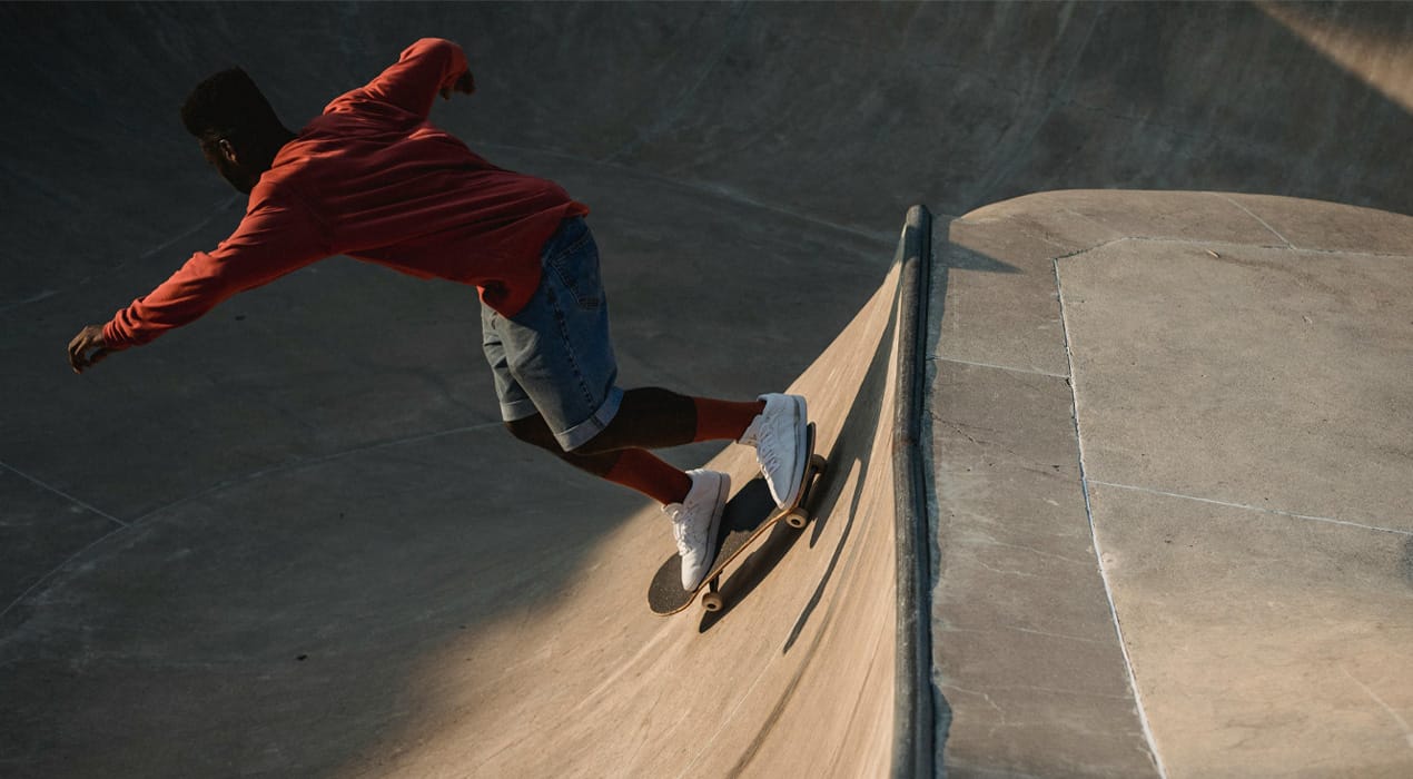 Person skateboarding on a half pipe